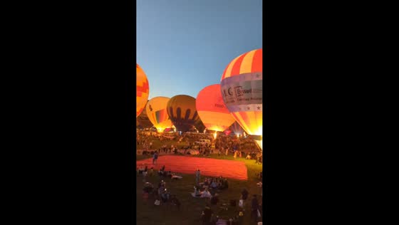 Hot-air balloons glow during opening day of Balloon Fiesta in Albuquerque, USA