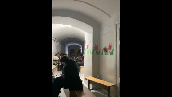 People sing songs in the shelter during the shelling in the Ternopil region