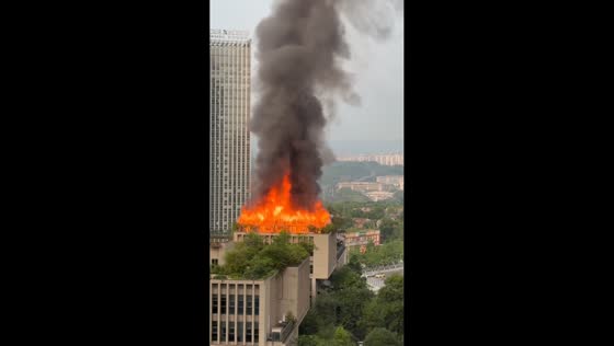 Massive rooftop fire erupts at high-rise building in Chongqing, China