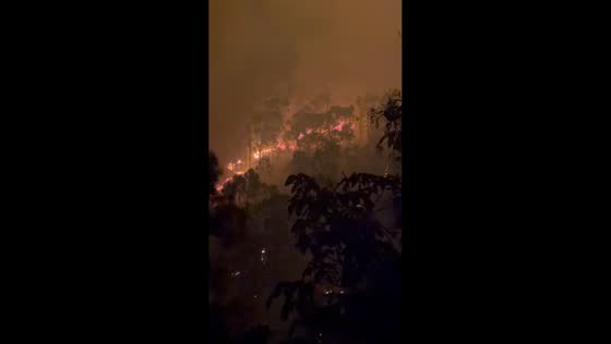 Fire crews conduct major backburning operation at Mount Archer near Rockhampton, Australia