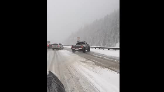 Truck slides on snowy road near Georgetown, Colorado