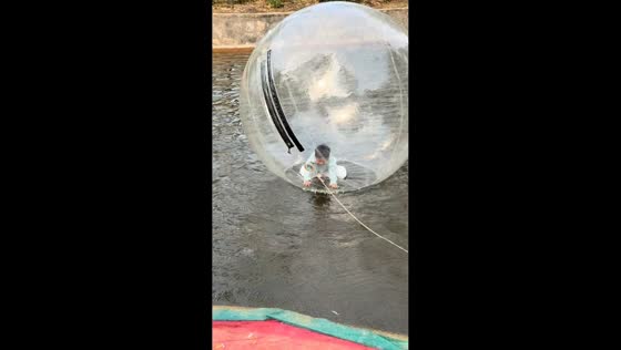 Boy enjoys water ball ride in Shandong, China