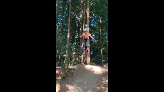 Rider crashes into tree while attempting hill ramp trick in Memmingen, Germany
