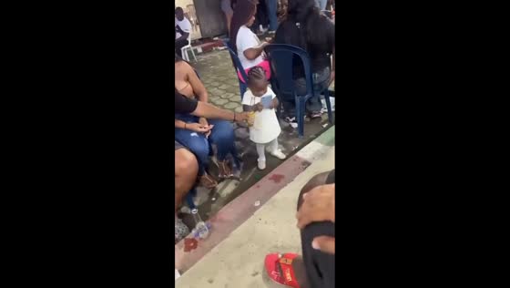 Child refuses bottle with gesture during event in Mosquera, Nariño, Colombia