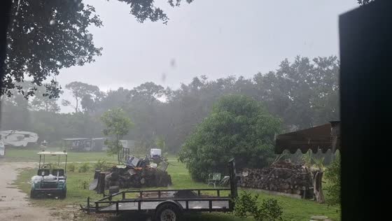 Heavy rain and close lightning strike during thunderstorm in North Fort Myers, USA