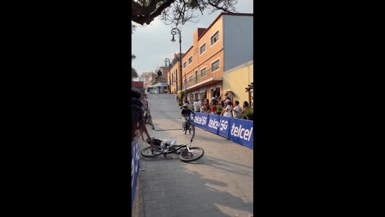 Biker falls during urban downhill event in Atlixco, Mexico