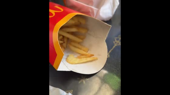 Fries arranged as Nike logo on McDonald’s burger in Bailleul, France
