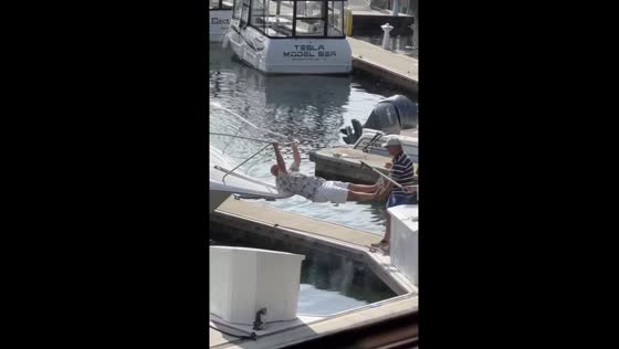 Man pulled by legs to dock boat in Newport Beach, California