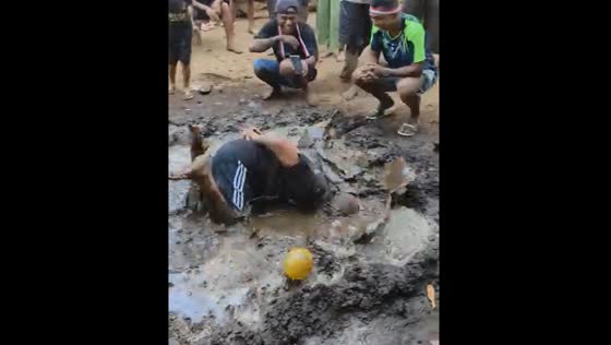 Man falls into muddy puddle while playing traditional game on Lembata Island