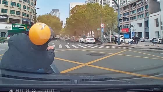 Motorcycle rider struck by car near intersection in Zhejiang, China