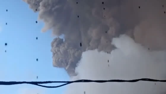 Water mixed with ash drips from roof near volcanic eruption