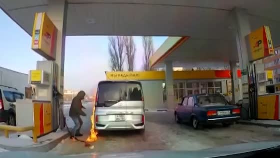 A man lights up a gas tank with a lighter in Voronezh