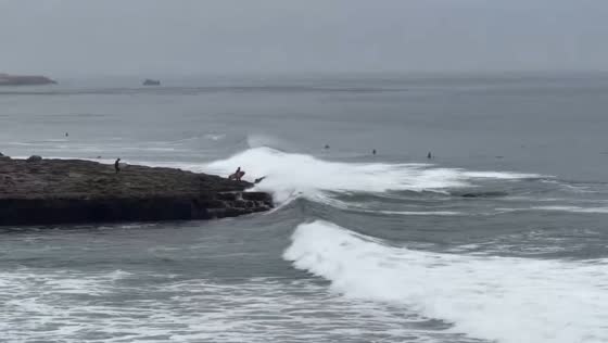 Powerful waves crash into rocky coastline in Santa Cruz, USA