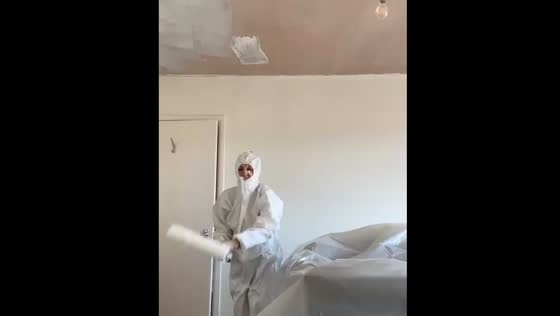 Painter gets covered in paint while working on ceiling
