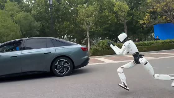 Humanoid robot races alongside a Hongqi electric sedan in Changchun, China