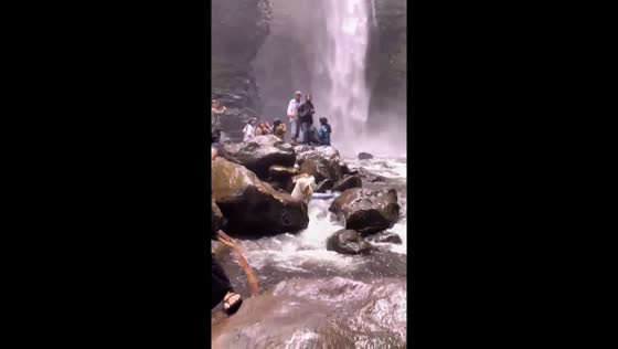 Person slips and falls near waterfall in Kerinci Regency, Indonesia