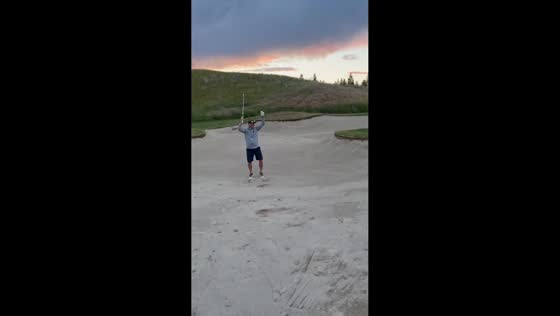 Golfer sinks spectacular bunker shot at Predator Ridge Resort in Vernon, Canada