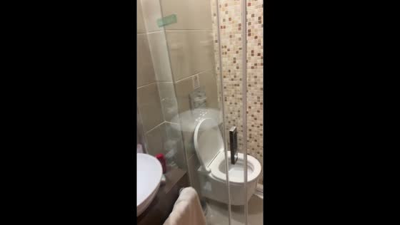 Unusual combined shower and toilet setup in Pigadia, Greece