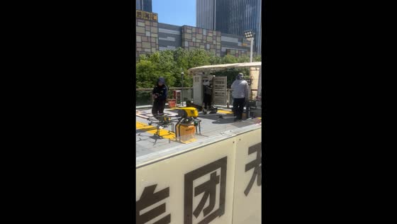 Meituan delivery drone takes off with a package in Shenzhen, China