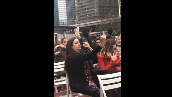 Woman throws shade on the Trump Tower!