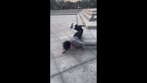 Skateboarder loses balance and falls during trick in Henan, China