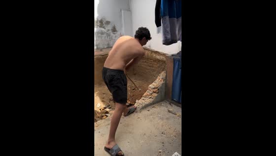 Man loses balance while using sledgehammer during demolition in Tangara, Rio Grande do Norte, Brazil
