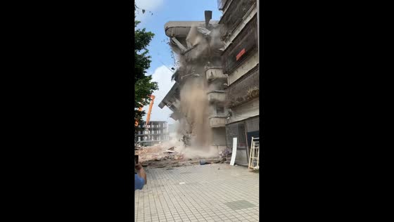 Controlled demolition sends dust cloud through area in Guangdong, China