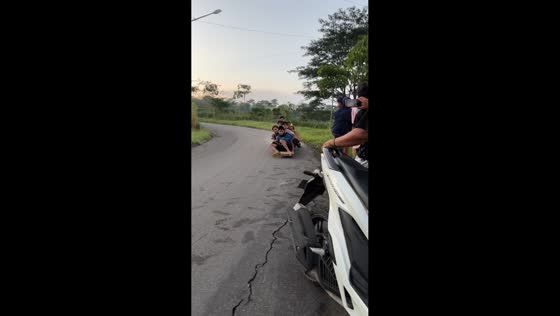 Friends riding wooden skate crash into scooter in Kediri, Indonesia