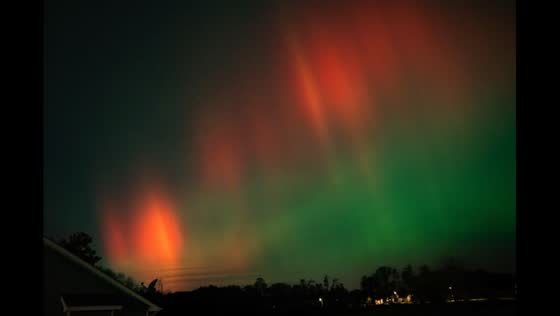 Aurora borealis curtain illuminates Johnston, Iowa, USA
