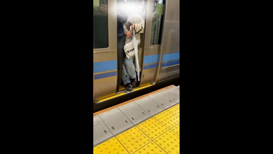 Rush-hour commuters pack crowded metro train in Shibuya, Japan