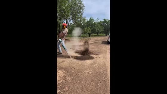 Rodent bursts out of burrow after Varmitgetter blast in San Diego, California, USA