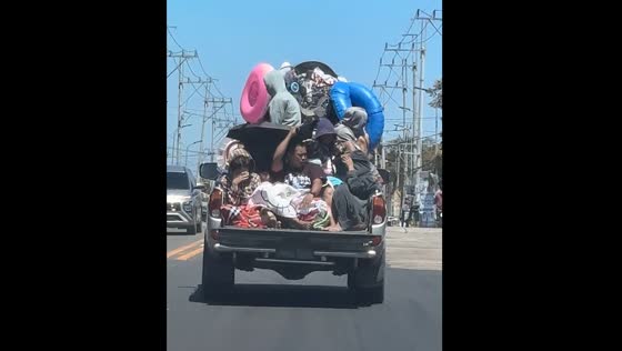 Overloaded pickup truck carries beachgoers in Quezon Province