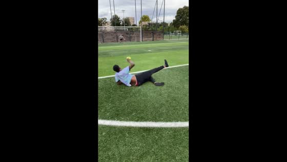 Man slips after kicking football in Paris, France