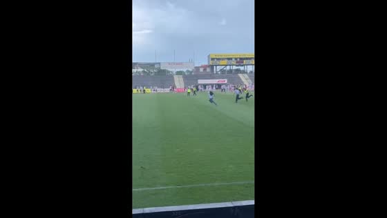 Girl chased by security after running onto field for autographs in Vienna, Austria