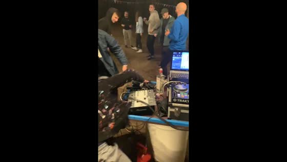 DJ and partygoer fall after bro fist moment in Minsk, Belarus
