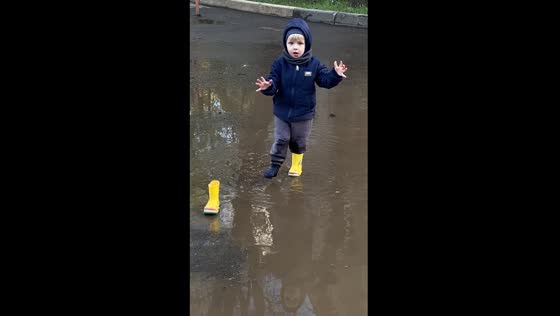 Child's puddle adventure: one boot misadventure