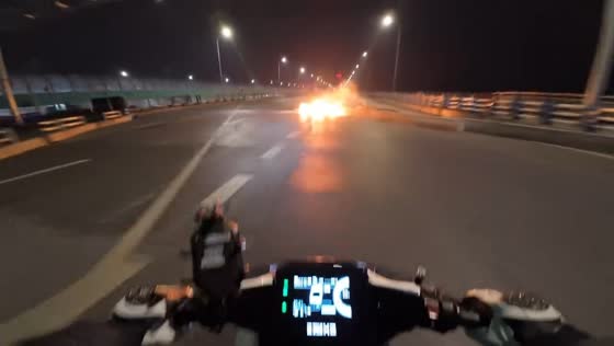 Motorcycle loses control and catches fire after crash in Jiangsu, China