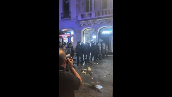 Riot police confront protesters during housing demonstration in Barcelona, Spain
