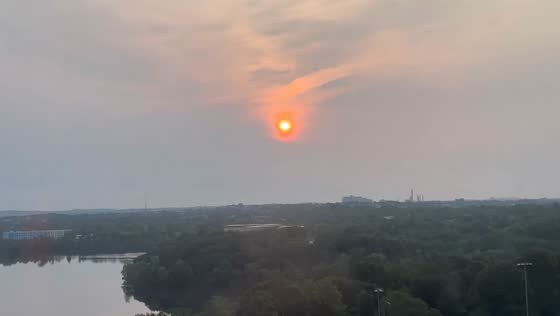 Hazy wildfire smoke sunset in Cambridge, Massachusetts