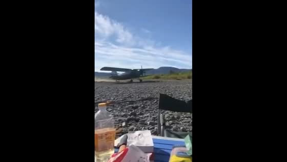 An-2 plane lands near tourists on riverbank in Yakutia, Russia