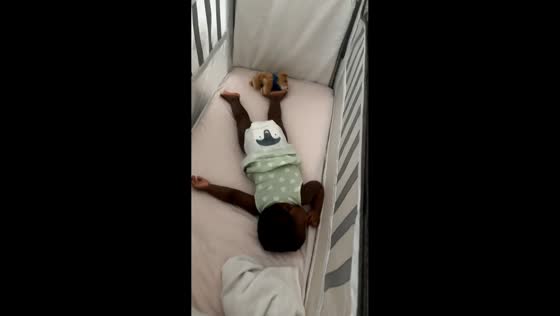 Little girl caught playing in crib in Newchapel, UK