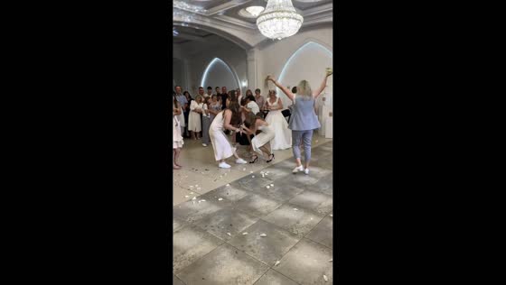 Tug-of-war over bridal bouquet at wedding reception in Ivano-Frankivsk, Ukraine