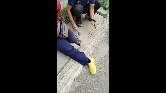 Woman’s leg gets stuck in roadside drain gap in West Java, Indonesia