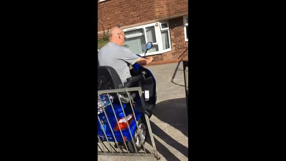 Man learning to use mobility scooter bumps into wall in England, UK