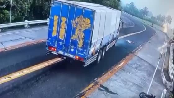 Close call in Juban: motorist swerves to avoid collision with truck