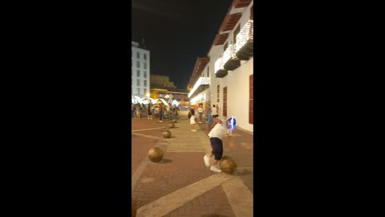 Boy trips while playing with finger rocket in Cartagena, Colombia
