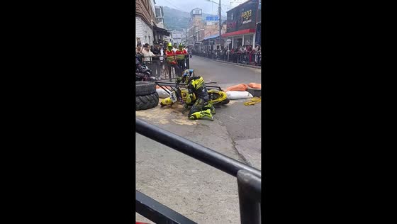 Motorcycle racer crashes through safety barrier in Mesitas del Colegio, Colombia