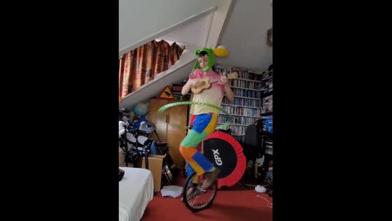 An incredible man goes viral for unicycling, ukulele playing, and hula hooping all at once