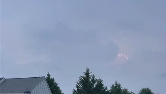 Thunderstorm clouds build and block lightning in Hunt Valley, Maryland, USA