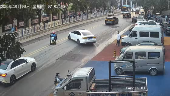 Car lightly collides with electric scooter riders during a U-turn in Chongqing, China